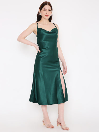 A beautiful lady in green silky satin dress